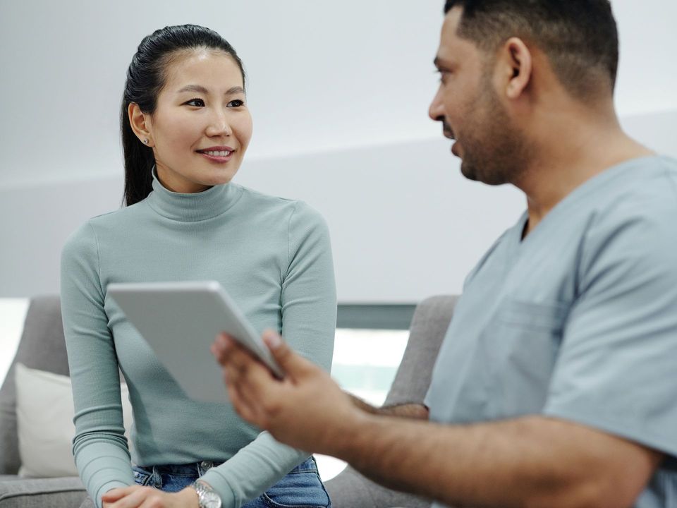 A woman in a private consultation with her doctor at Laraib Health Clinic